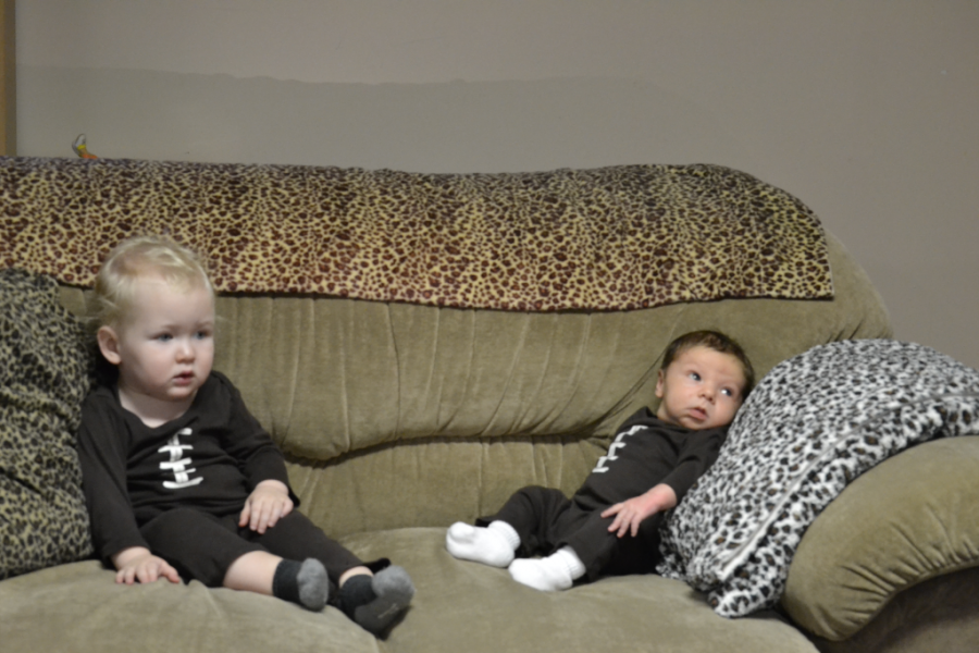 So two footballs were sitting on the cough.