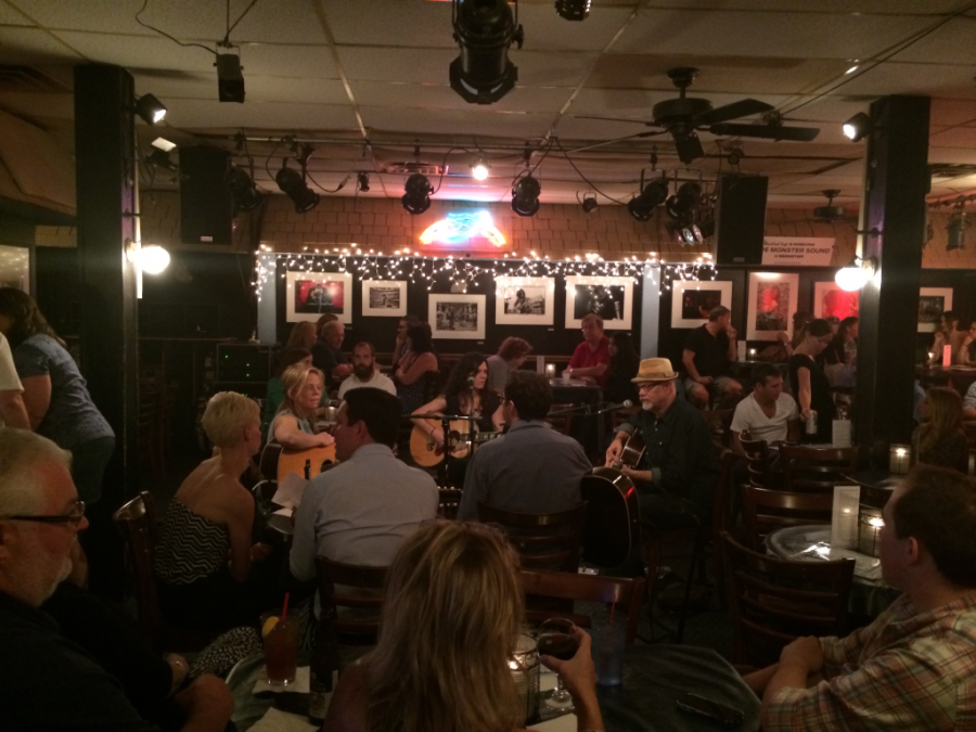 People play guitar just about anywhere you go here (Bluebird cafe)